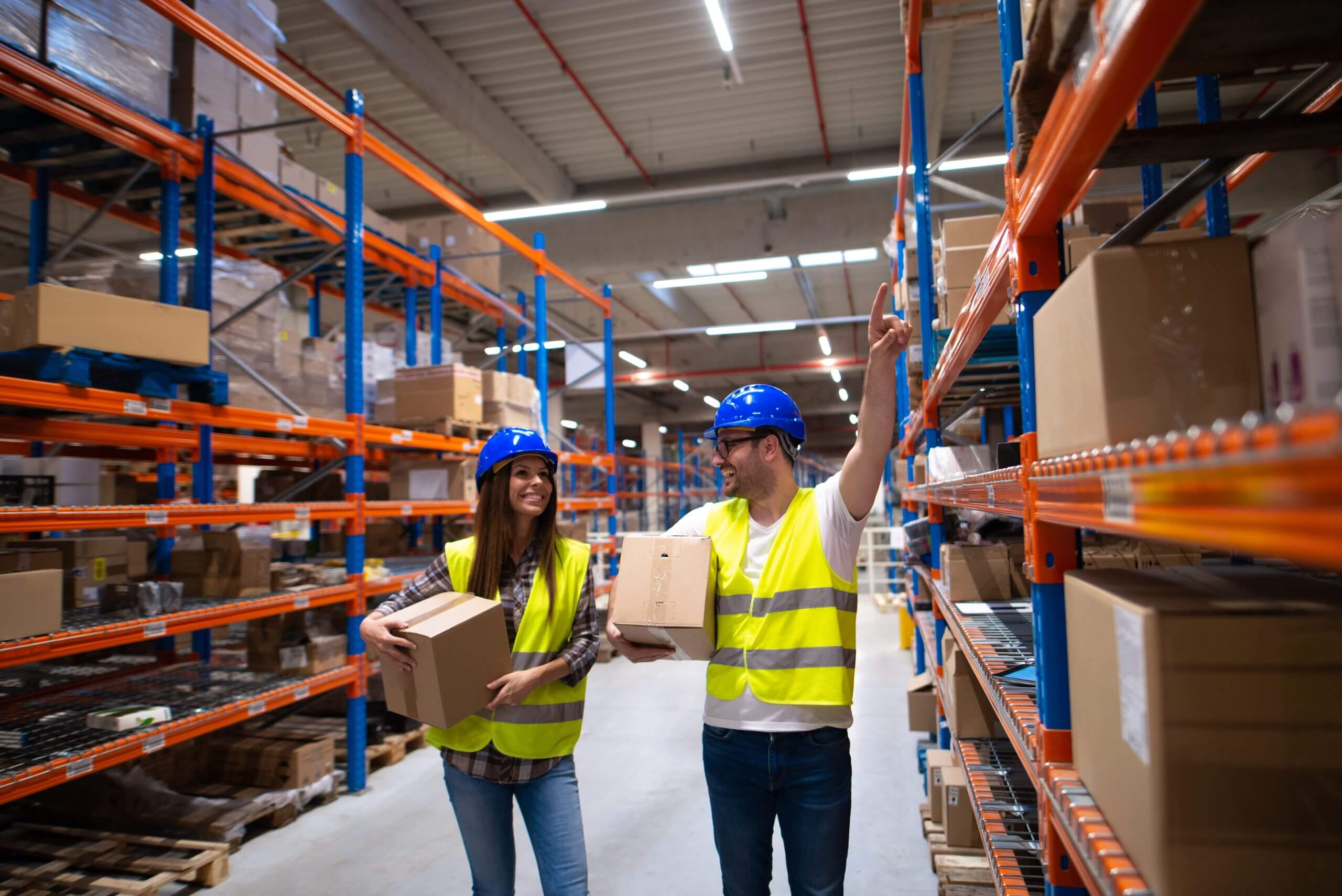 Busy warehouse workers organizing and moving goods in the B2B logistics environment. b2b and b2c